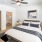 walk-in closet in bright bedroom