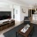well lit living room with a partial wall shared with bedroom on the other side
