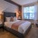 brick wall in carpeted bedroom