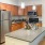 brightly lit kitchen with pendant lights over island
